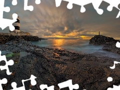 Chmury, Morze, Wexford, Skały, Latarnia morska Hook Head, Zachód słońca, Irlandia